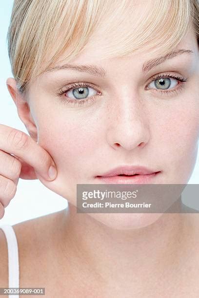 Pinching Cheek Photos And Premium High Res Pictures Getty Images