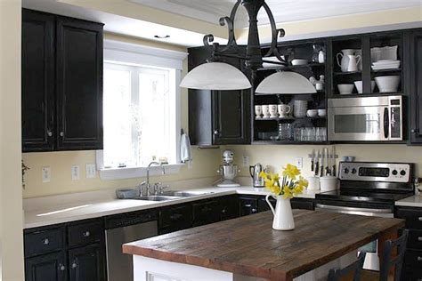 Wood cabinets are ideal for painting, but any surface that can be scuffed with sandpaper can be painted. Remodelaholic | Black Kitchen Cabinets! Guest Project Feature