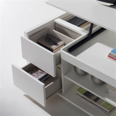 Il arrive bien souvent que l'on ait besoin de ranger toutes sortes d'objets divers dans le salon : Table basse relevable blanche rangements - Concept