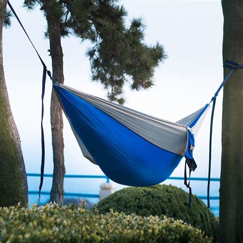 The tree straps are made from specially formulated polyester, it is very strong and sturdy, comes with 13 loops, you can adjust the height of the hammock from the ground according to the distance between the two trees with the loops, can achieve a weight bearing capacity of 600 lbs. Winner Outfitters Single & Double Camping Hammock With Tree Straps - Lightweight Nylon Portable ...