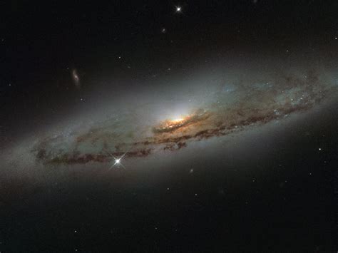 Spiral Galaxy Ngc 4845 Located Over 65 Million Light Years Away In The