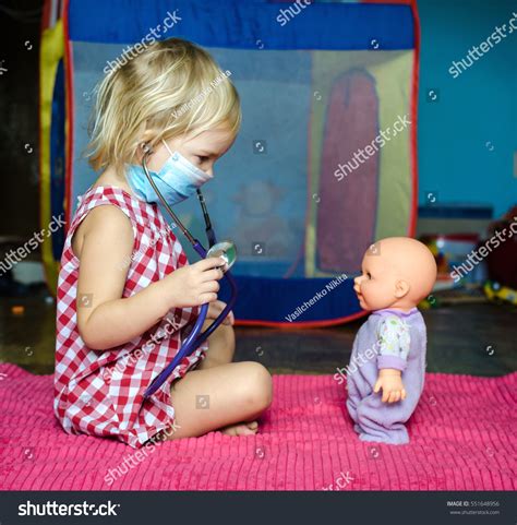 Little Girl Playing Doctor Her Doll Stock Photo 551648956 Shutterstock