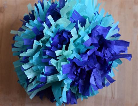 Fluff up your pom poms and get ready to cheer for your. How to Make Tissue Paper Pom Poms | Paper pom poms, Diy ...