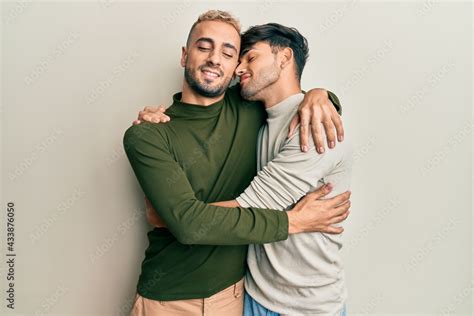 Homosexual Gay Couple Standing Together Wearing Casual Clothes Hugging