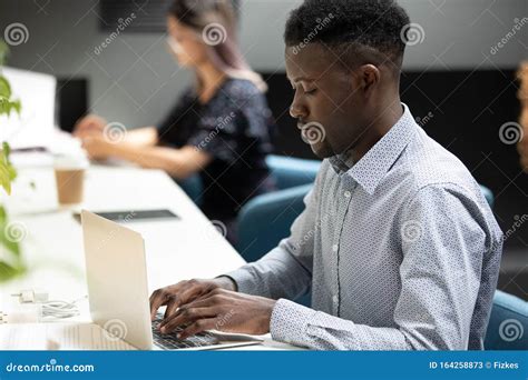 Concentrated African American Young Male It Developer Working In Office
