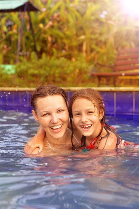 Premium Photo Mother And Daughter In Swimming Pool