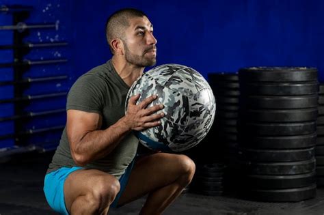 Premium Photo Latin Man Exercising In A Gym Using A Crossfit Medicine