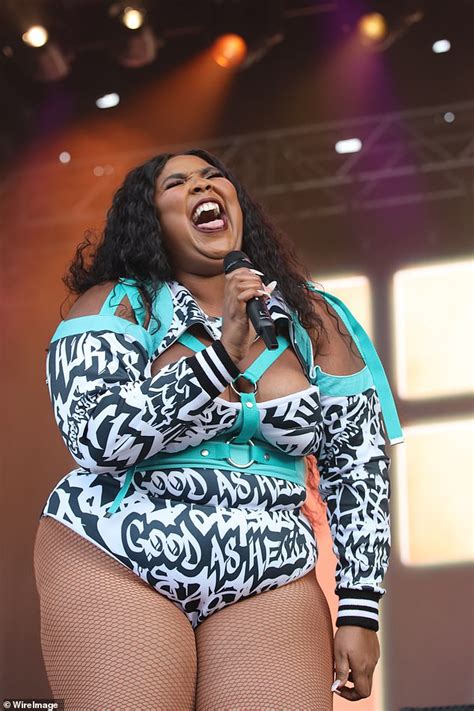 Lizzo Plays The Flute In The Nude As She Channels A Floral Goddess On