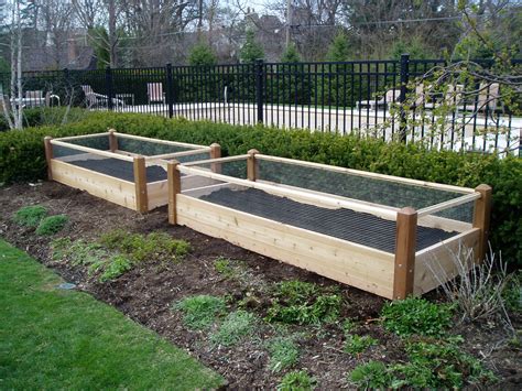 These raised beds were so easy. Two Raised Garden Beds with Rabbit Railing 3x8x2