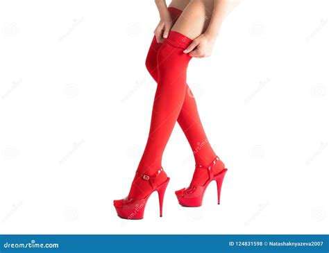 Female Legs In Fetish Red Stockings And Red High Heels Isolated On