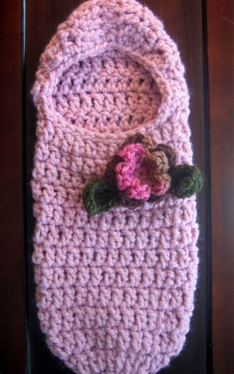 These 14 baby cocoon patterns provide a variety of styles for both boys and girls. Crochet Pattern | Hooded Baby Cocoon With Flower and Leaves