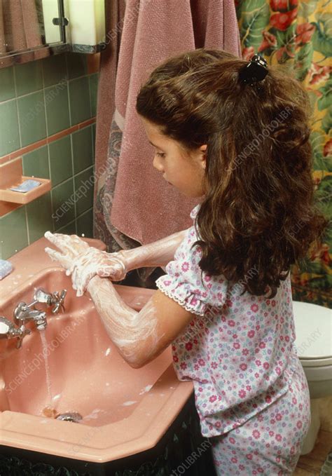 Young Girl Obsessively Washing Her Hands Stock Image M2450481