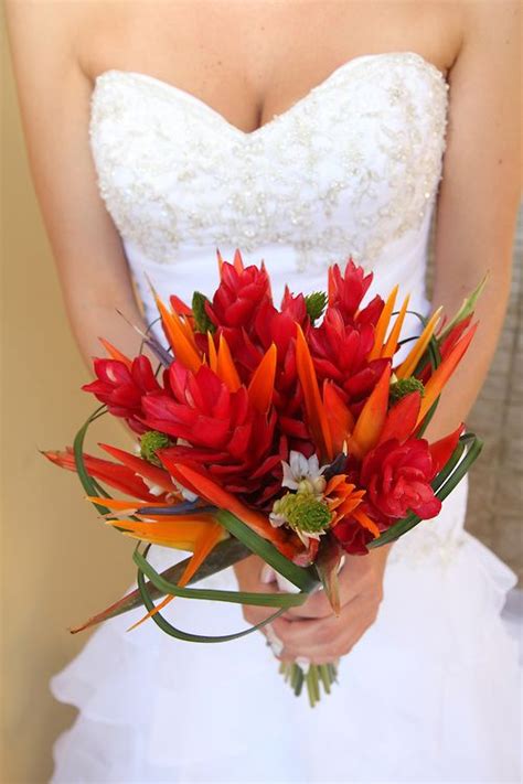 Wedding flower bouquets are held by the bride and bridesmaids. Bird of Paradise | Bouquet Wedding Flower