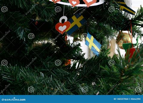 Christmas Tree Decorated With Several Swedish Paper Flags Stock Photo