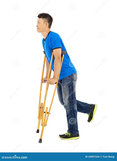 Full Length Of Young Asian Man On Crutches Stock Photo Image Of