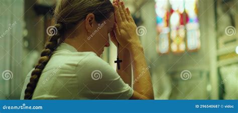 Adult Girl Knelt Down In Thanksgiving Prayer To God In Cathedral Church