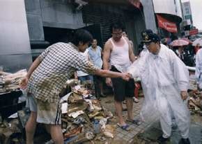 Compound of 颱 (violent wind) and 風 (wind). 總統巡視台北市縣及基隆市受納莉颱風侵襲成災地區