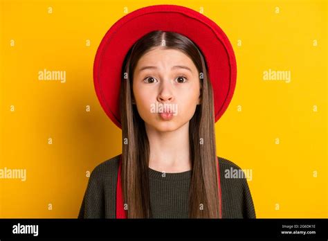 Photo Portrait Of Little Girl With Pouted Lips Sending Air Kiss