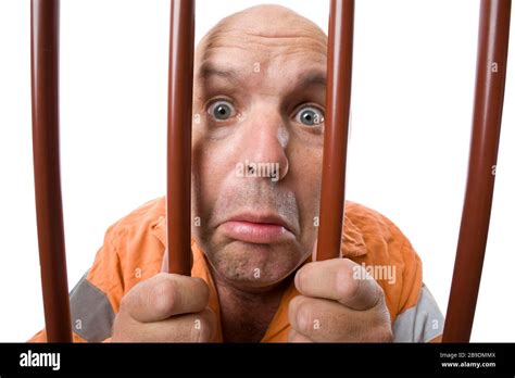 A Sad And Sorry Criminal Behind Bars Stock Photo Alamy