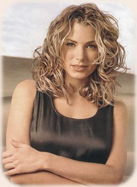 Curls have a soft look about them due to their curved nature and soft appearance to the eye. Curly hair medium length styles
