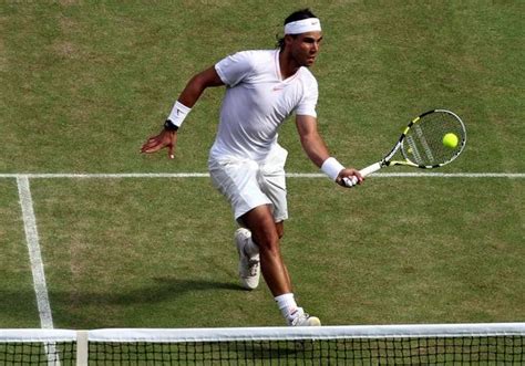 .swinging forehand and backhand volley, drop shot volley, slice serve, footwork and more!!! Rafael Nadal lefty forehand volley at Wimbledon 2010.JPG