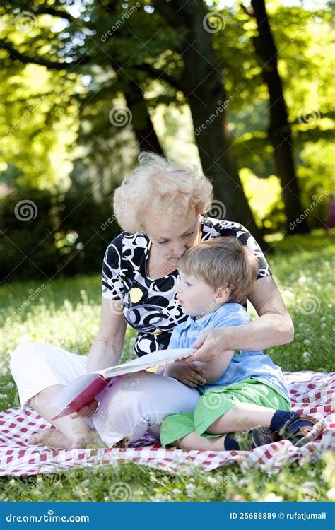 Grandmother Reading The Book To Her Grandson Stock Image Image Of