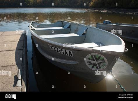 Row Boat Tied Up At Dock In Lake Stock Photo Alamy