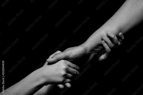 Black And White Mother And Daughter Holding Hands Helping Hands Stock