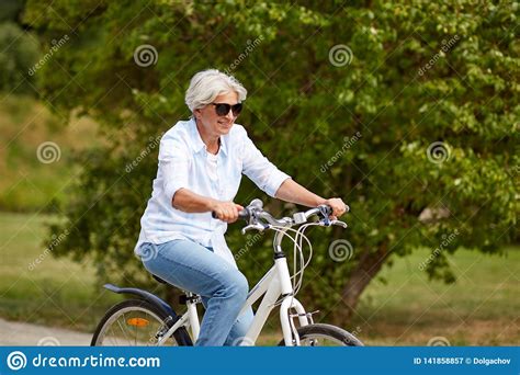 Happy Senior Woman Riding Bicycle At Summer Park Stock Image Image Of