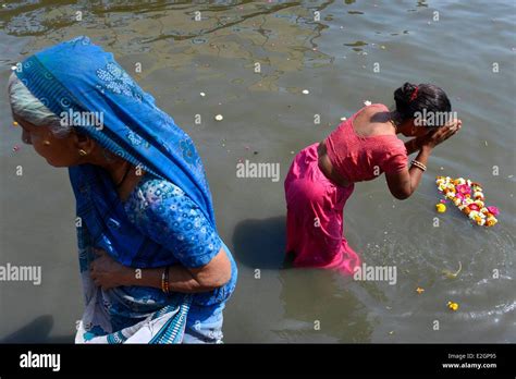India Uttar Pradesh State Mathura Women Make Puja In River During Holi