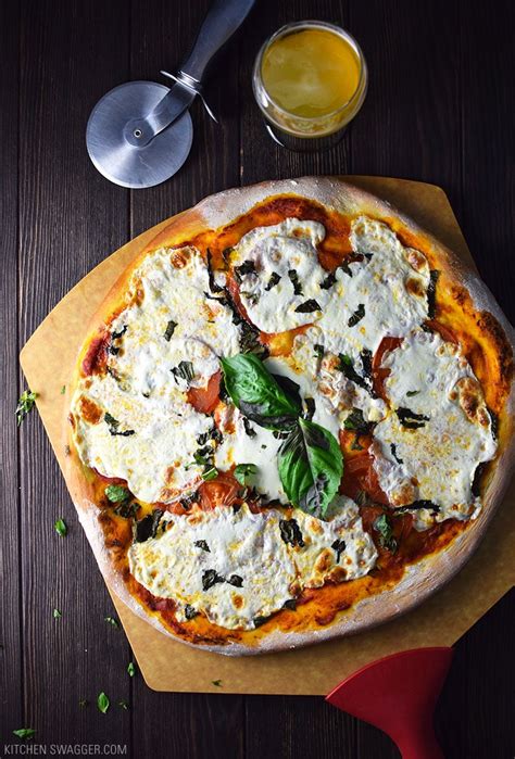 What does margherita pizza have on it? Classic Margherita Pizza Recipe | Kitchen Swagger