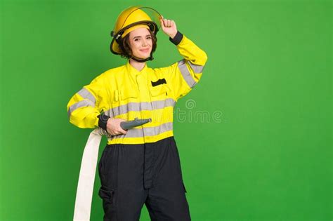 Photo Of Charming Positive Firewoman Dressed Yellow Uniform Arm Hand