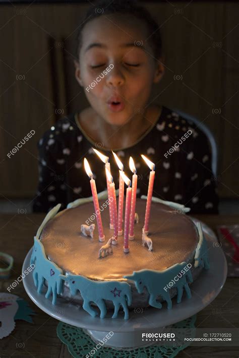 Girl Blowing Out Candles On Birthday Cake — Food Birthday Party