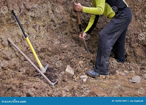 Man Digging A Hole With A Shovel For The Project Stock Image Image Of