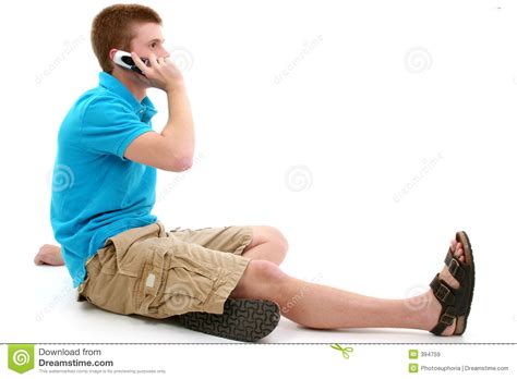 Casual Teen Speaking On Cellphone Royalty Free Stock