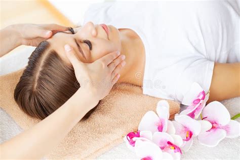 Hands Of Cosmetologist Making Manual Relaxing Rejuvenating Facial Massage For Woman In Beauty