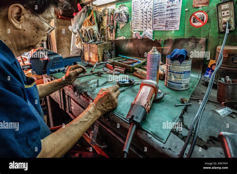 Bangkok, Thailand. 05th Apr, 2023. A gunsmith is repairing a firearm