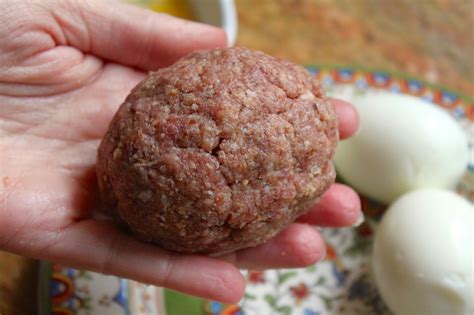 Runny yolk and deep fried to boot. Scotch Eggs ~ Deep-Fried, Sausage-Covered Hard Boiled Eggs