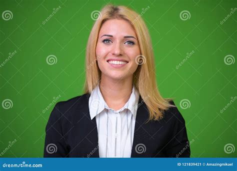 Young Beautiful Blonde Businesswoman Against Green Background Stock