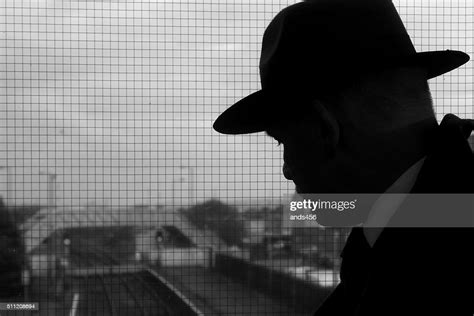 Silhouette Of Man In Fedora Hat High Res Stock Photo Getty Images