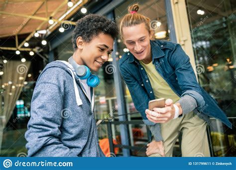 Happy Young Friends Using New Technological Device Stock Image Image