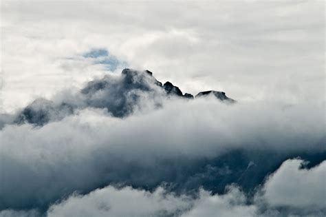 Photo Of Clouds Hugging A Norwegian Mountain Peak Photos From