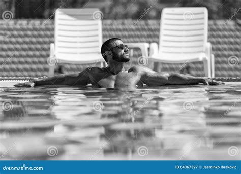 Man Resting Relaxed On Edge Of Swimming Pool Stock Image Image Of