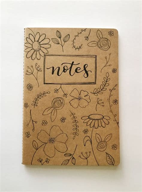 A Notebook With Flowers And The Word Notes Written In Black Ink On Top