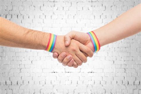 hands with gay pride wristbands make handshake stock image image of alternative partner