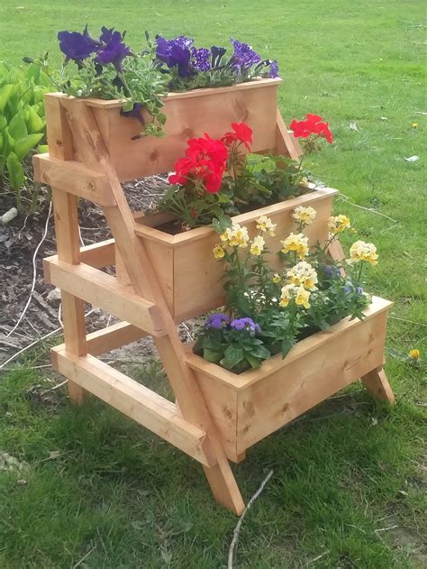 3 Tier Planter Stand With 3 Planters Braced So That It Will Last For