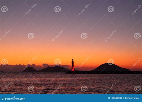Seascape At Sunset Lighthouse On The Coast Stock Photo Image Of