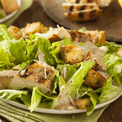 A caesar salad (also spelled cesar and cesare) is a green salad of romaine lettuce and croutons dressed with lemon juice (or lime juice), olive oil, egg, worcestershire sauce, anchovies, garlic. Caesar Salad - Eli's Pizza Pasta