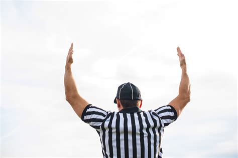 Rear View Of American Football Referee Showing Touchdown Stock Photo ...
