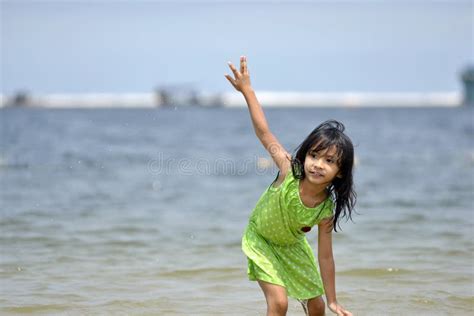 Asian Girl Playing On The Beach In The Summertime Stock Image Image